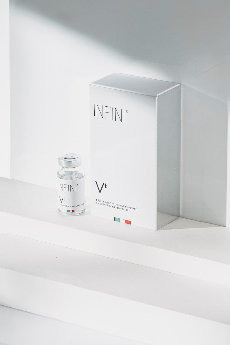 INFINI skincare product and packaging on a white background