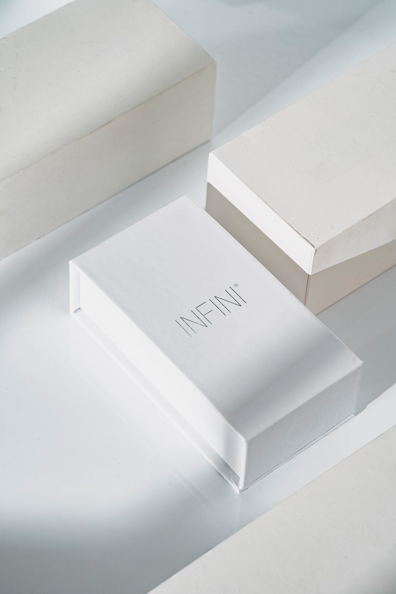 'INFINI' branding on a light gray background